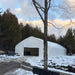 TMG Industrial 30' x 50' Straight Wall Peak Ceiling Storage Shelter with Heavy Duty 17 oz PVC Cover & Drive Through Doors, TMG-ST3050V