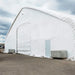 TMG Industrial Pro Series 70' x 100' Dual Truss Storage Shelter with Heavy Duty 32 oz PVC Cover & Drive Through Doors, TMG-DT70100-PRO