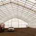 TMG Industrial Pro Series 70' x 150' Dual Truss Storage Shelter with Heavy Duty 32 oz PVC Cover & Drive Through Doors, TMG-DT70150-PRO