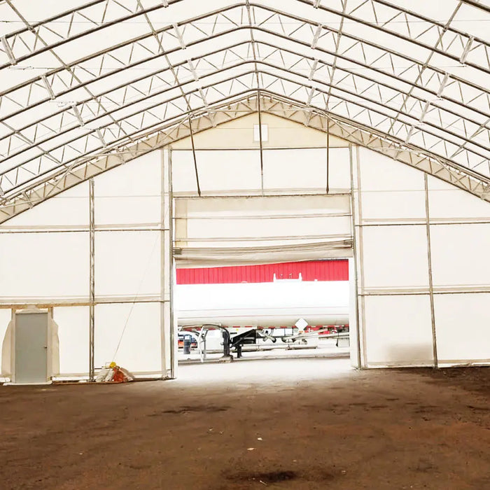 TMG Industrial Pro Series 70' x 150' Dual Truss Storage Shelter with Heavy Duty 32 oz PVC Cover & Drive Through Doors, TMG-DT70150-PRO